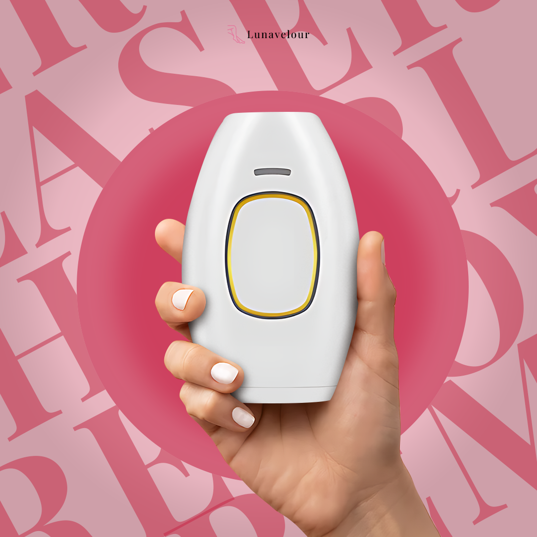Hand holding a white electronic device with a pink background featuring blurred letters